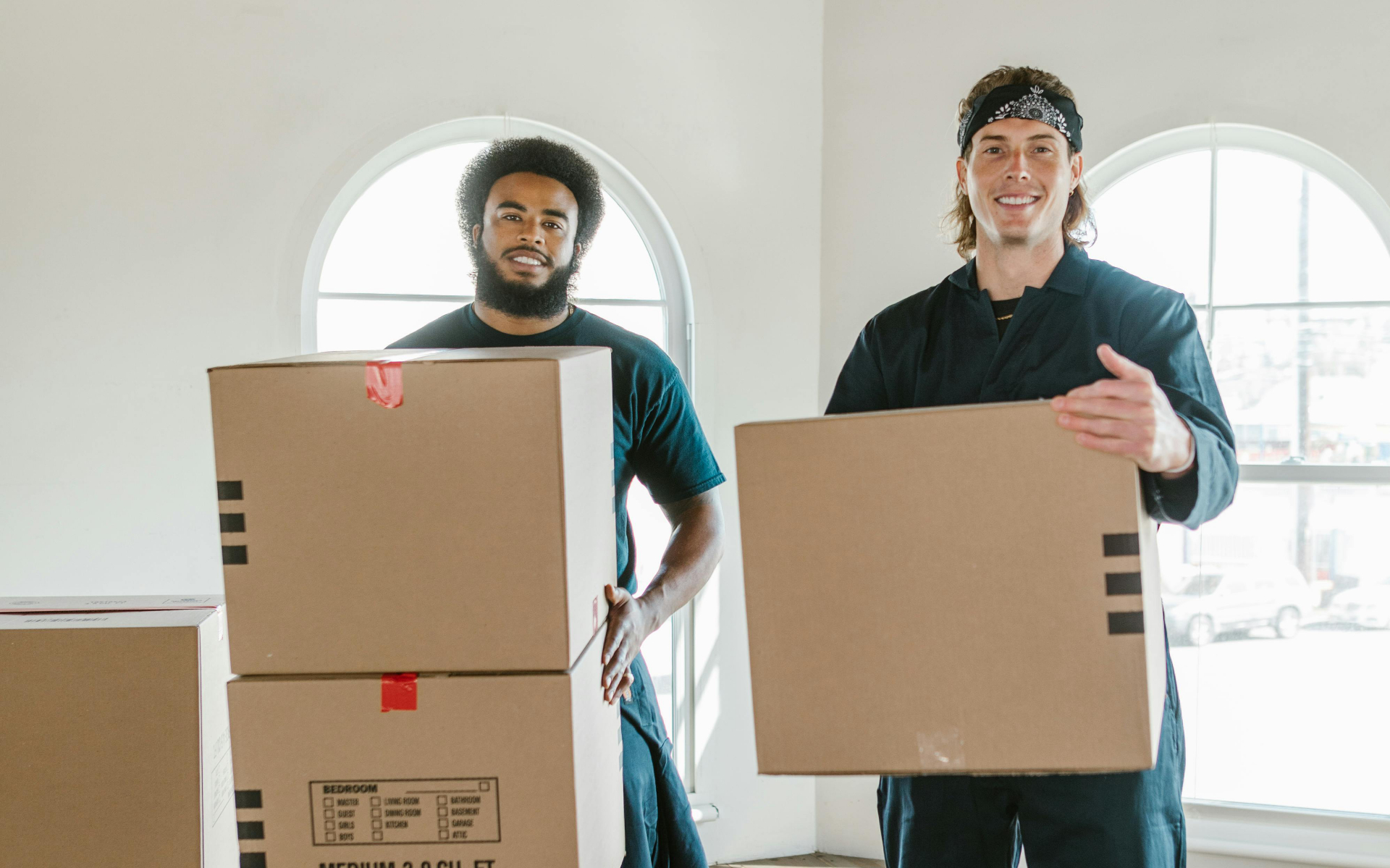 Professional movers carefully handling boxes