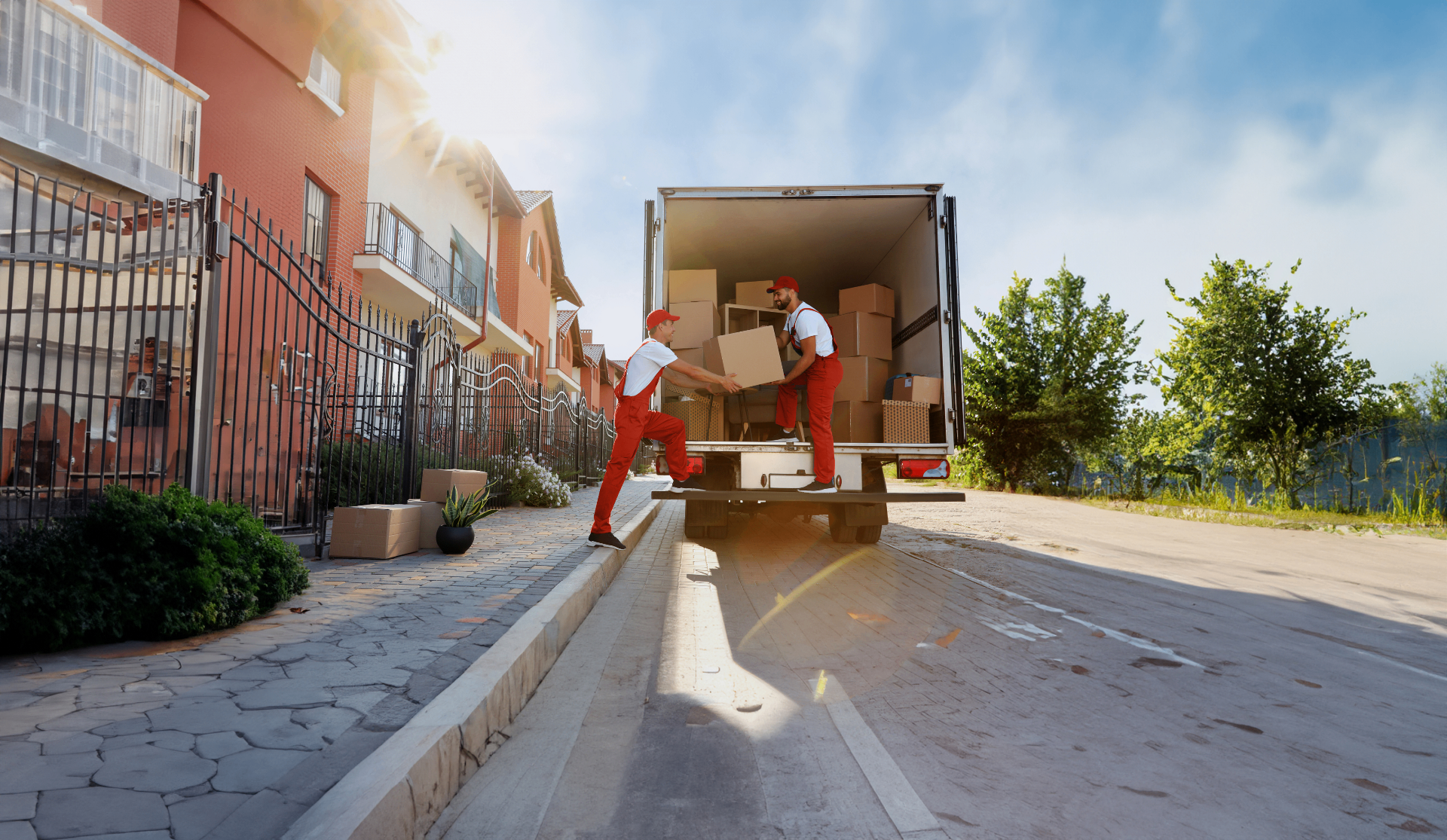 Professional movers carrying boxes